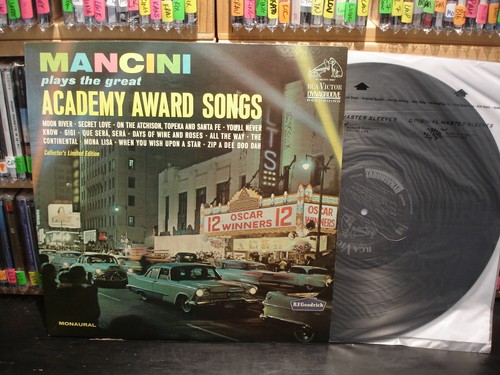 Henry mancini plays the - ~,
